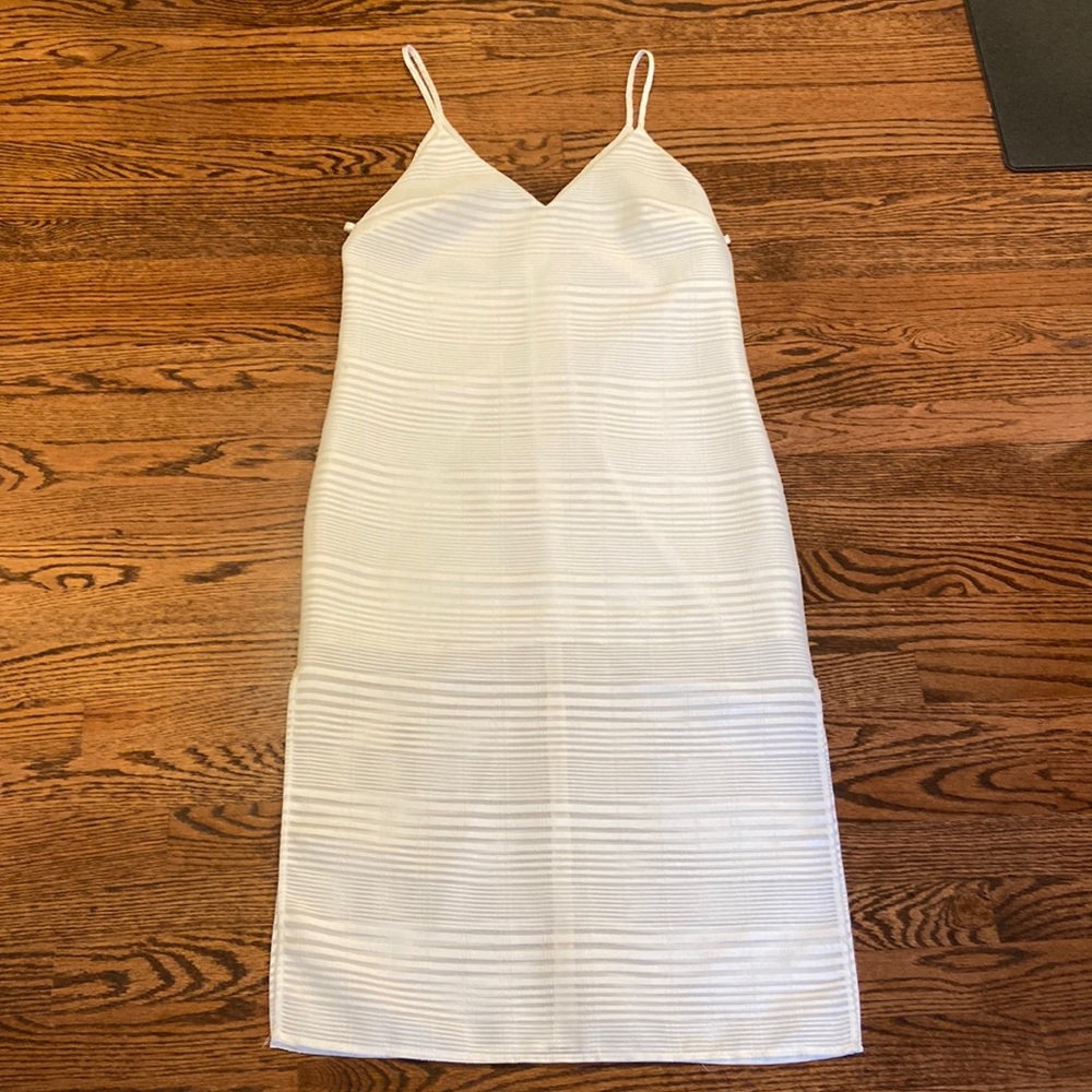 Never worn white dress perfect for rehearsal dinner or bridal shower
